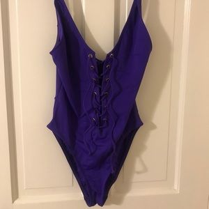 Purple lace up one piece bathing suit